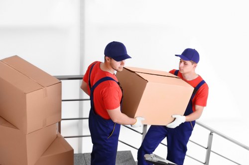 Removal team preparing household items for transport in Anerley
