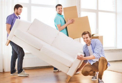 House removalists loading furniture for a home move in Anerley