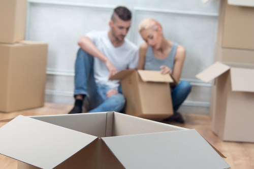 Packed boxes and furniture ready for transport by a removals crew