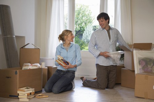 Loading furniture into a removal truck on a residential street